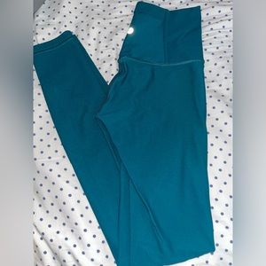 Teal blue Lululemon leggings. Size 4. Worn once.